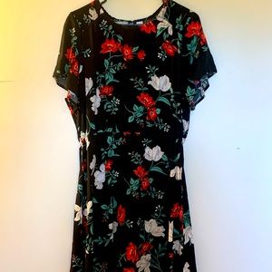 Black floral dress. Flowy, drapery, elastic waist, smocking at shoulder.